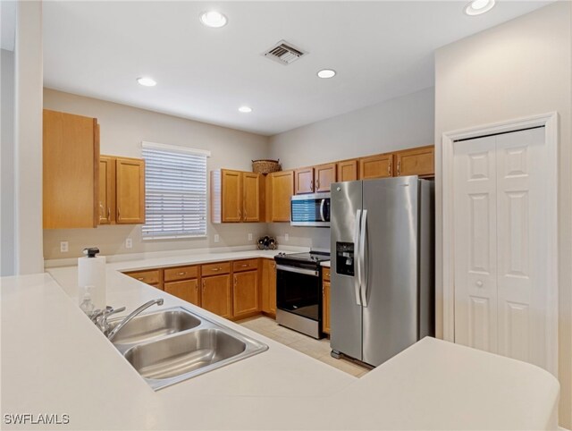 kitchen with sink and appliances with stainless steel finishes