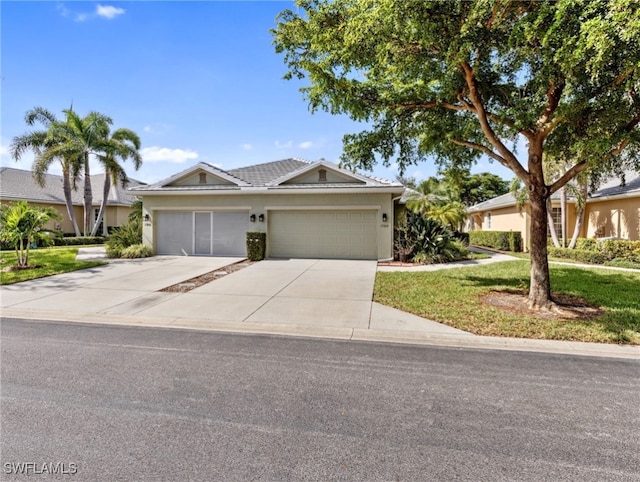 single story home featuring a garage