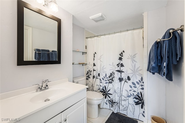 bathroom featuring tile patterned flooring, vanity, toilet, and walk in shower