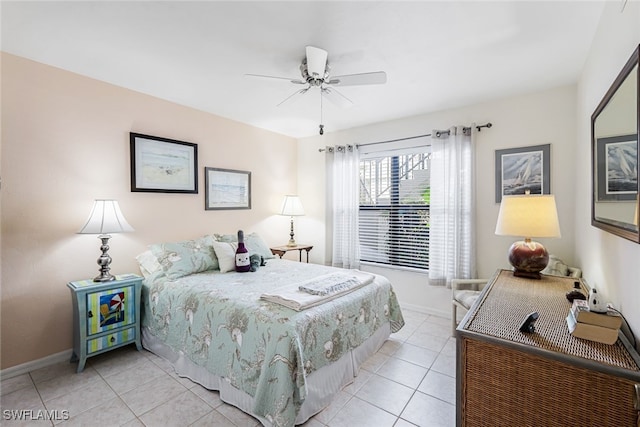 bedroom with light tile patterned floors and ceiling fan