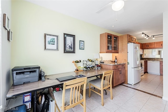 interior space with ceiling fan