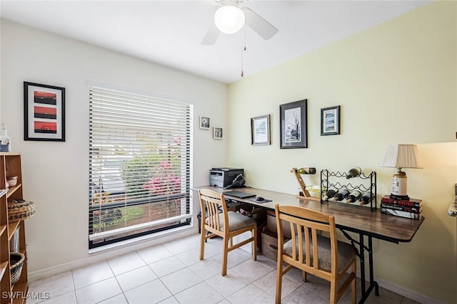 home office with ceiling fan and light tile patterned flooring