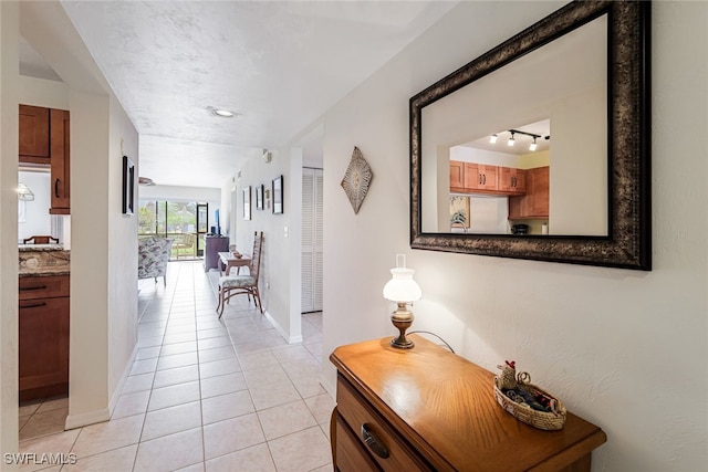 hallway with light tile patterned floors