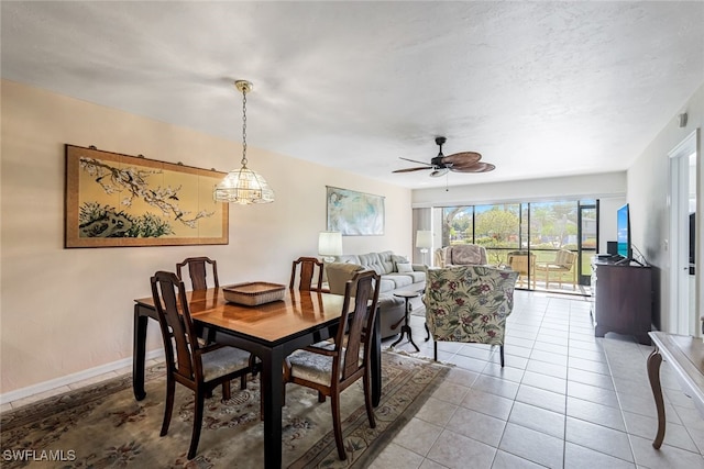 tiled dining room with ceiling fan