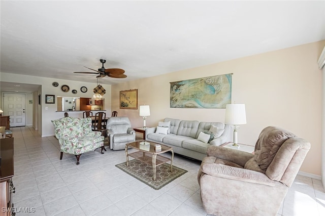 living room featuring ceiling fan and light tile patterned flooring