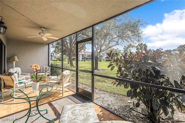 sunroom / solarium with ceiling fan