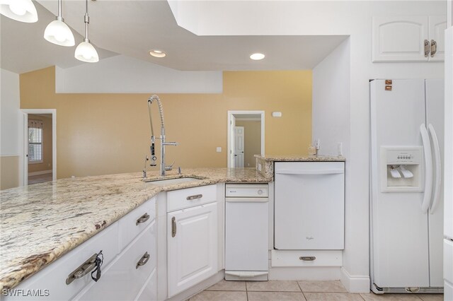 kitchen with white cabinets, light stone counters, pendant lighting, white appliances, and light tile patterned floors