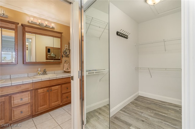 bathroom with vanity and wood-type flooring