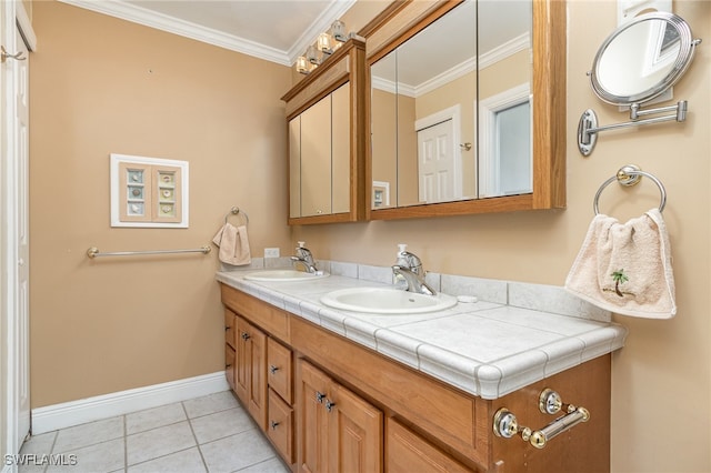 bathroom featuring crown molding, tile patterned flooring, and vanity