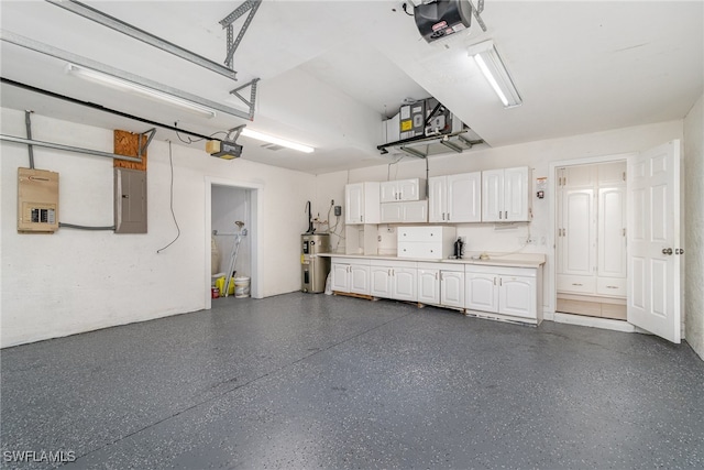 garage with a garage door opener, electric water heater, and electric panel