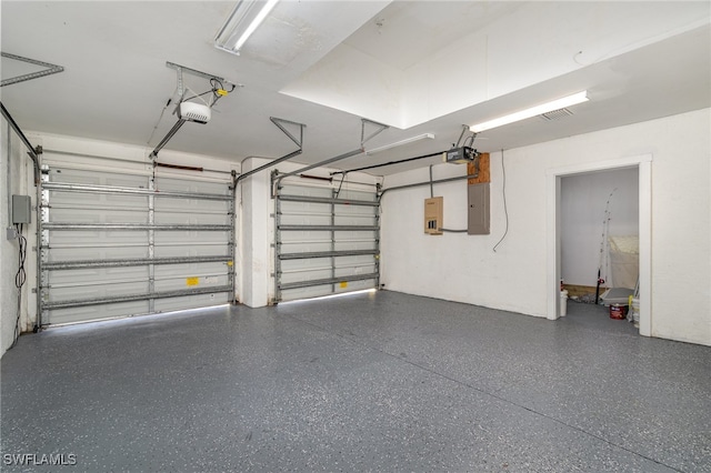 garage with electric panel and a garage door opener