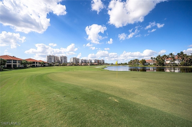 view of home's community featuring a view of city, golf course view, and a water view