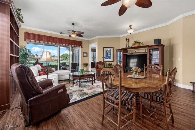 dining room featuring ornamental molding, ceiling fan, and dark hardwood / wood-style flooring