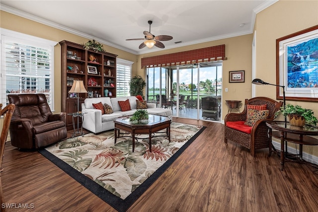 living area with baseboards, visible vents, ceiling fan, ornamental molding, and wood finished floors