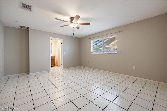 tiled empty room with ceiling fan