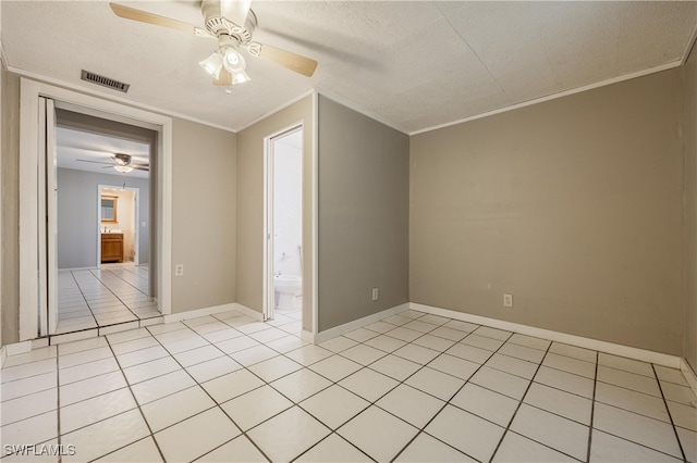 interior space featuring crown molding, light tile patterned floors, a textured ceiling, and ceiling fan