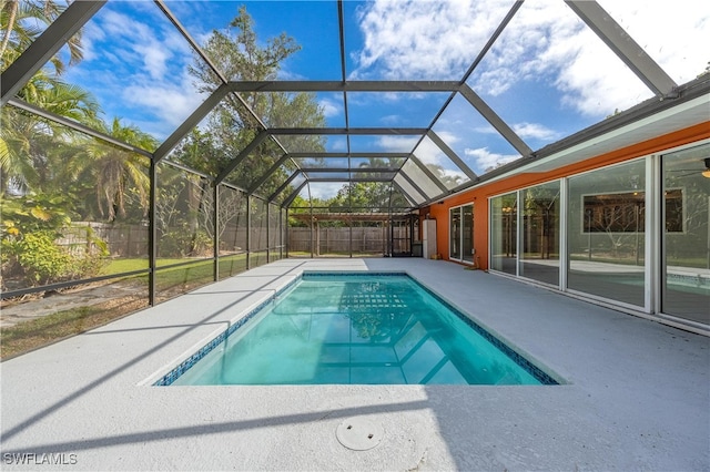 view of pool featuring a lanai and a patio