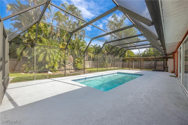 view of pool featuring a lanai and a patio