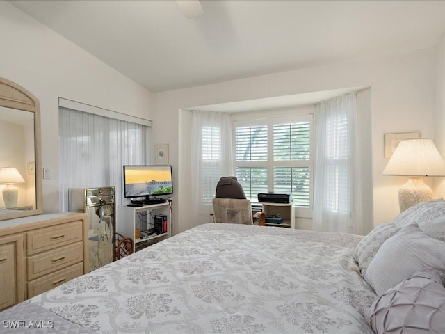 bedroom with vaulted ceiling and ceiling fan