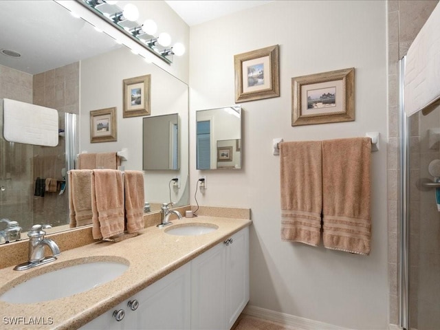 bathroom featuring walk in shower and vanity