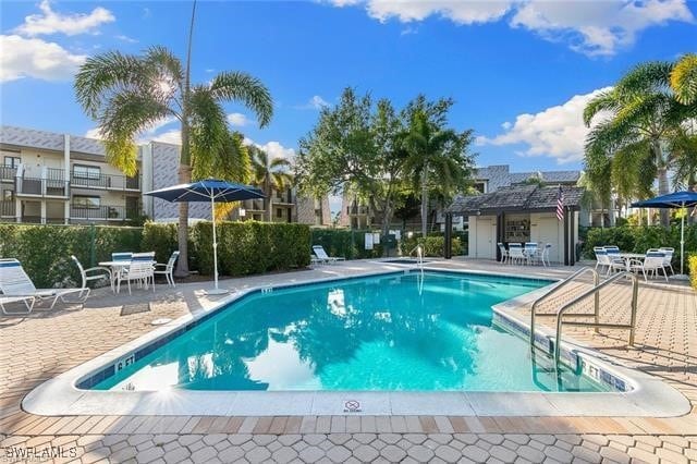 view of swimming pool featuring a patio area