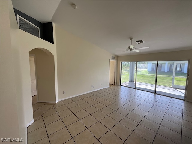 tiled spare room with ceiling fan