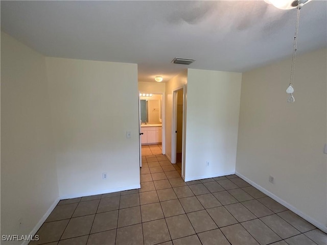 2917 43rd St W, Lehigh Acres, FL 33971 - tiled spare room featuring baseboards