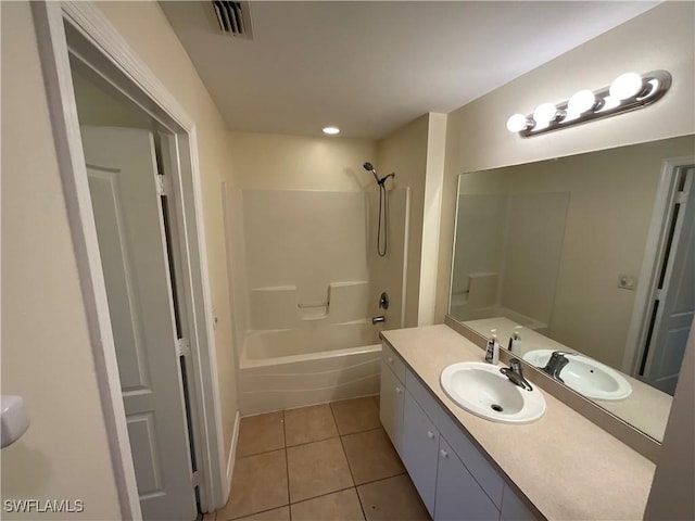 bathroom with tile patterned flooring, vanity, and bathtub / shower combination