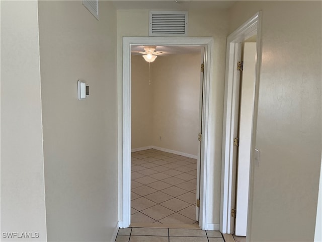 corridor featuring light tile patterned flooring