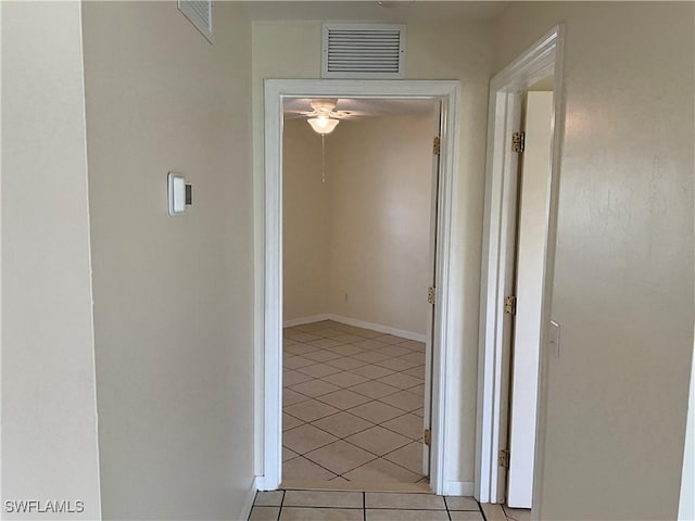 2917 43rd St W, Lehigh Acres, FL 33971 - corridor featuring light tile patterned floors and baseboards
