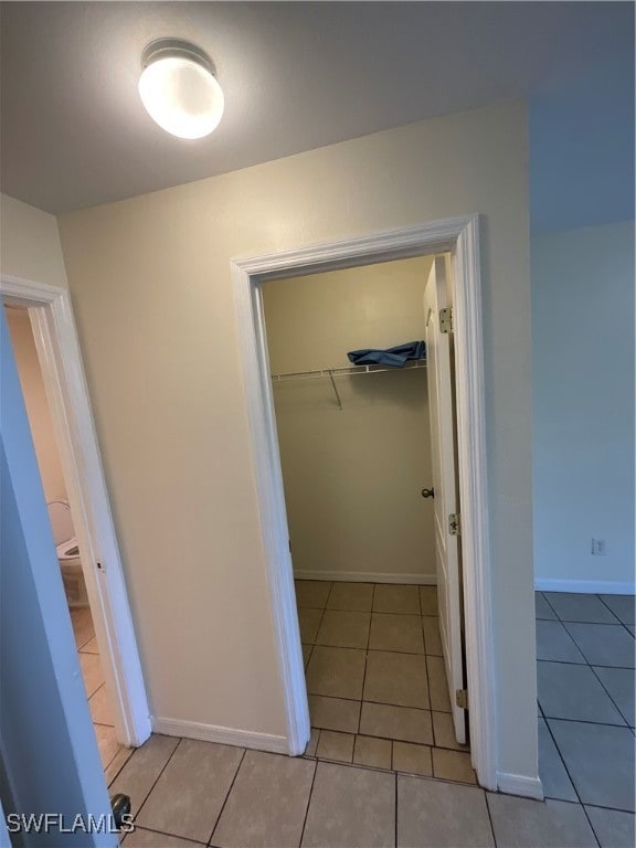 hall with light tile patterned flooring