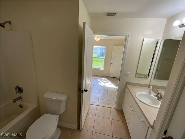 full bathroom with vanity,  shower combination, tile patterned flooring, ceiling fan, and toilet