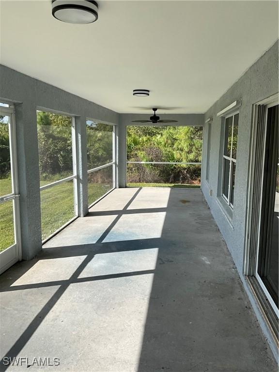 2917 43rd St W, Lehigh Acres, FL 33971 - unfurnished sunroom with ceiling fan