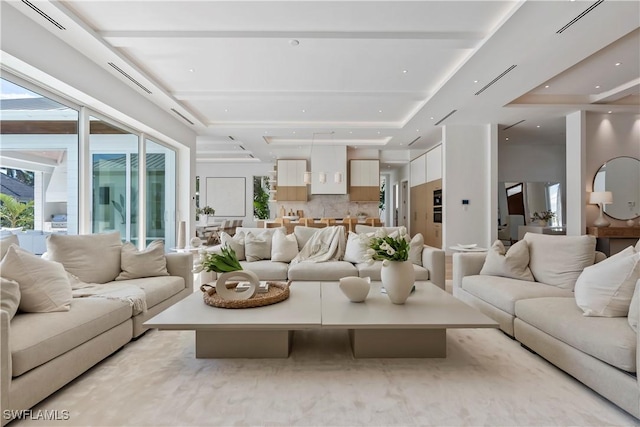 living room featuring a tray ceiling