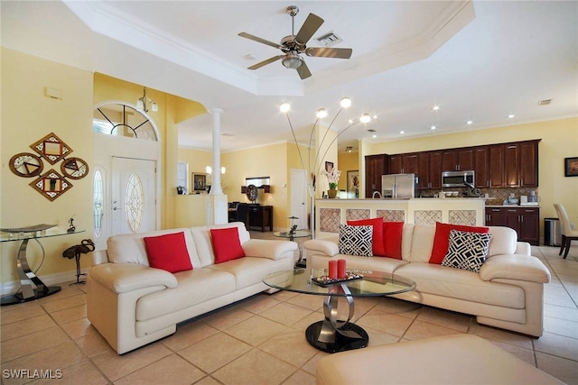 tiled living room featuring a raised ceiling, ceiling fan, and crown molding