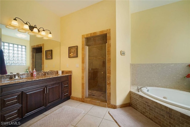 bathroom with vanity, shower with separate bathtub, and tile patterned floors