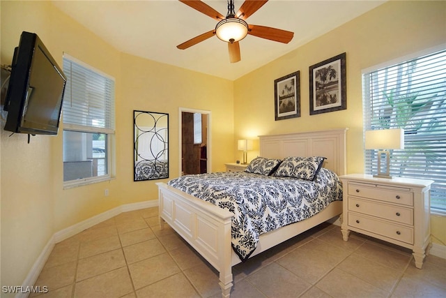 bedroom with light tile patterned floors and ceiling fan