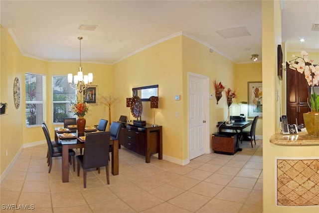 tiled dining area featuring a chandelier and ornamental molding