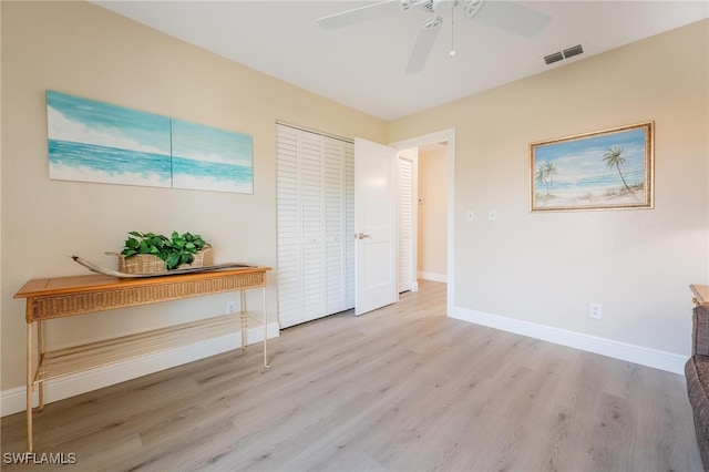 interior space featuring light hardwood / wood-style flooring and ceiling fan