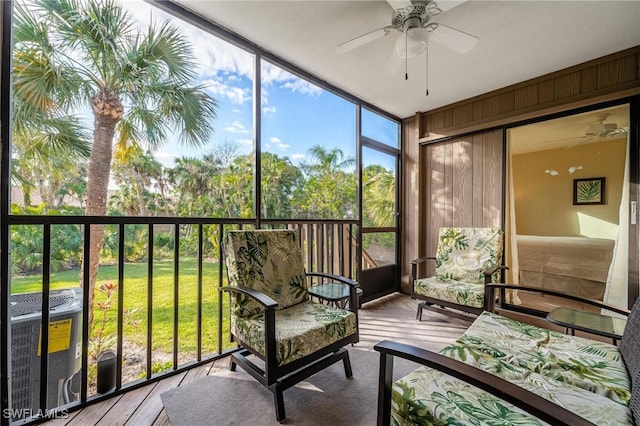 sunroom featuring ceiling fan