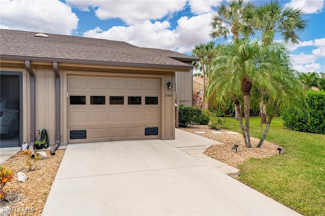 exterior space with a lawn and a garage