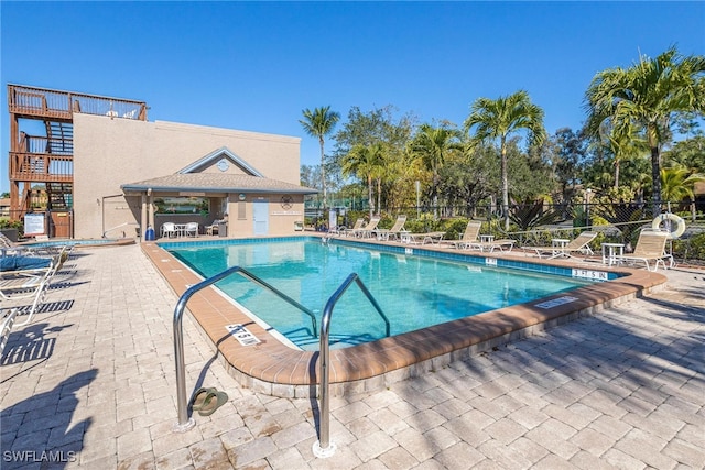 view of swimming pool with a patio area