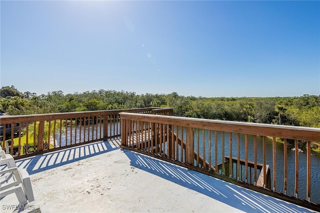 wooden deck with a water view