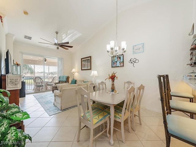 dining space featuring lofted ceiling, light tile patterned floors, and ceiling fan with notable chandelier