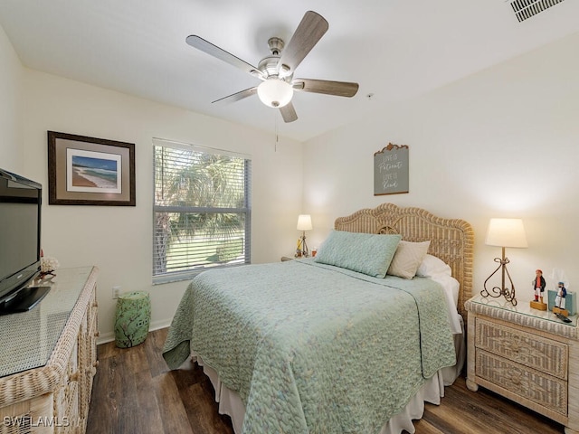 bedroom featuring ceiling fan and dark wood-type flooring