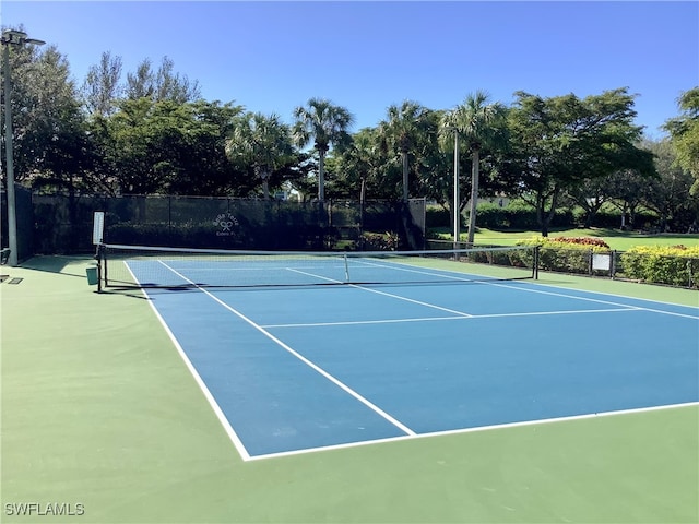 view of sport court with basketball hoop