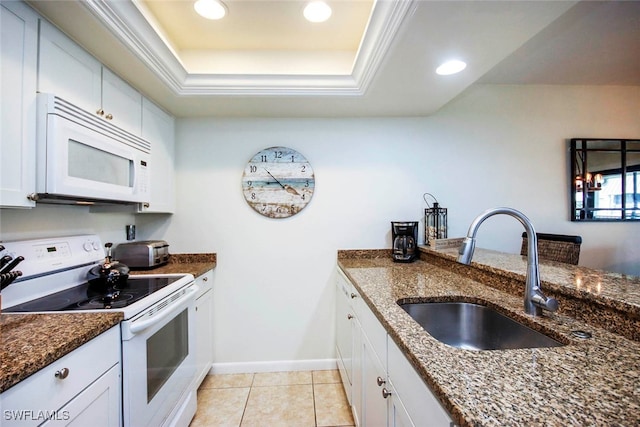 kitchen with white cabinetry, white appliances, and sink