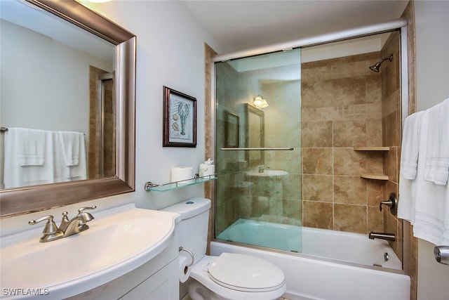 full bathroom with vanity, combined bath / shower with glass door, and toilet