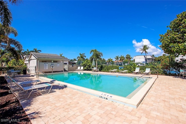 view of swimming pool featuring a patio area