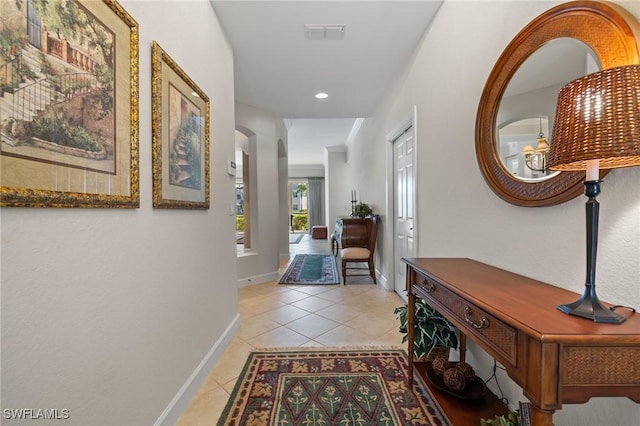 hallway featuring light tile patterned floors